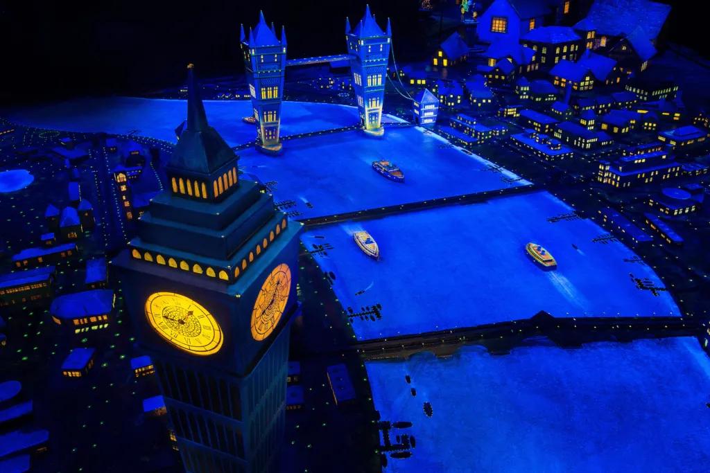 Night time ride inside with model of big ben and the river thames as you fly over.