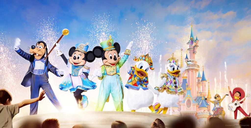 Mickey Mouse, Minnie Mouse, Donald Duck and more characters dancing in front of the pink and blue castle at Disneyland Paris.