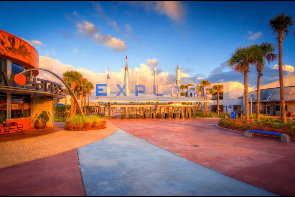 Rocket garden behind a large sign saying "EXPLORE". 