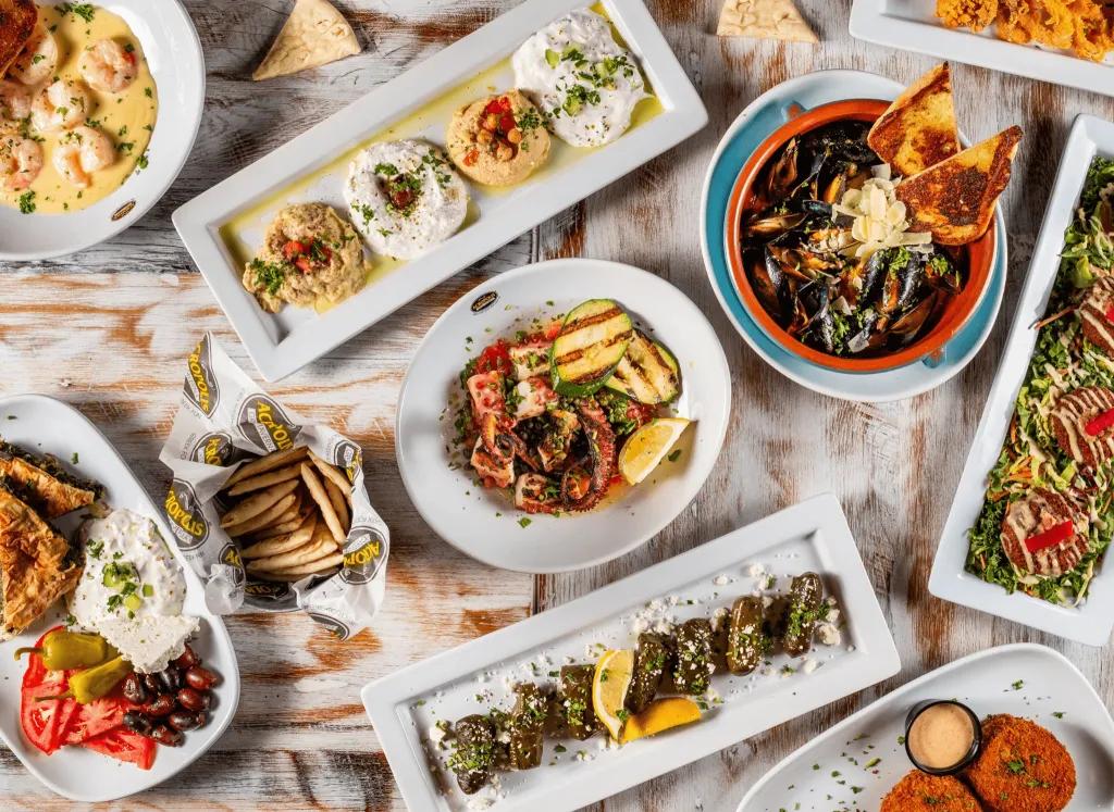 A bird's eye view of a table full of Greek food