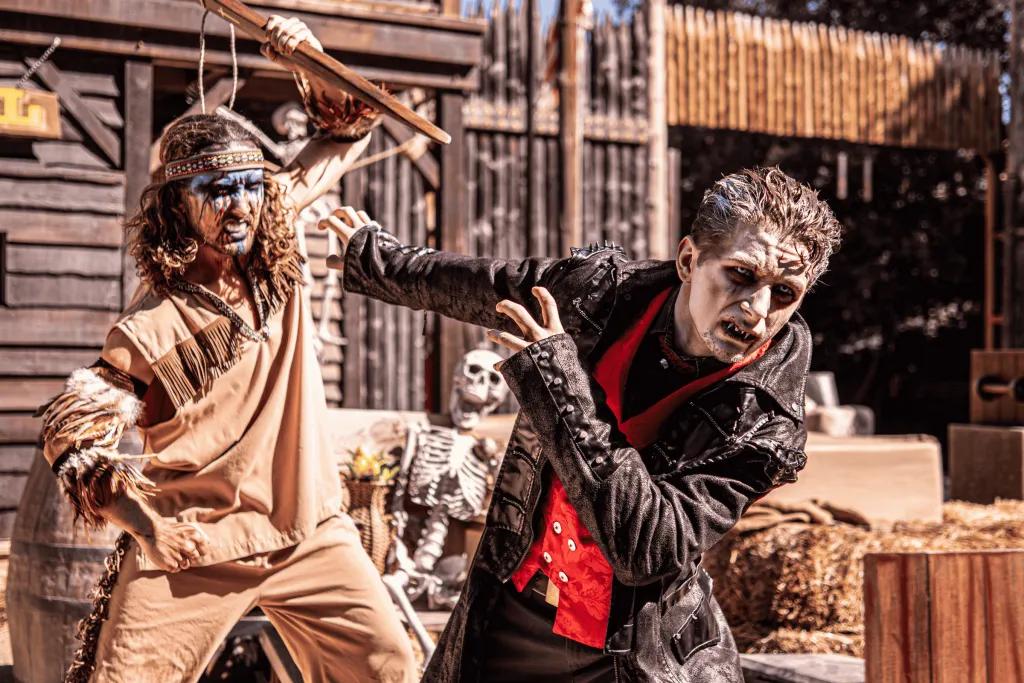 Performers in a wild west themed halloween show