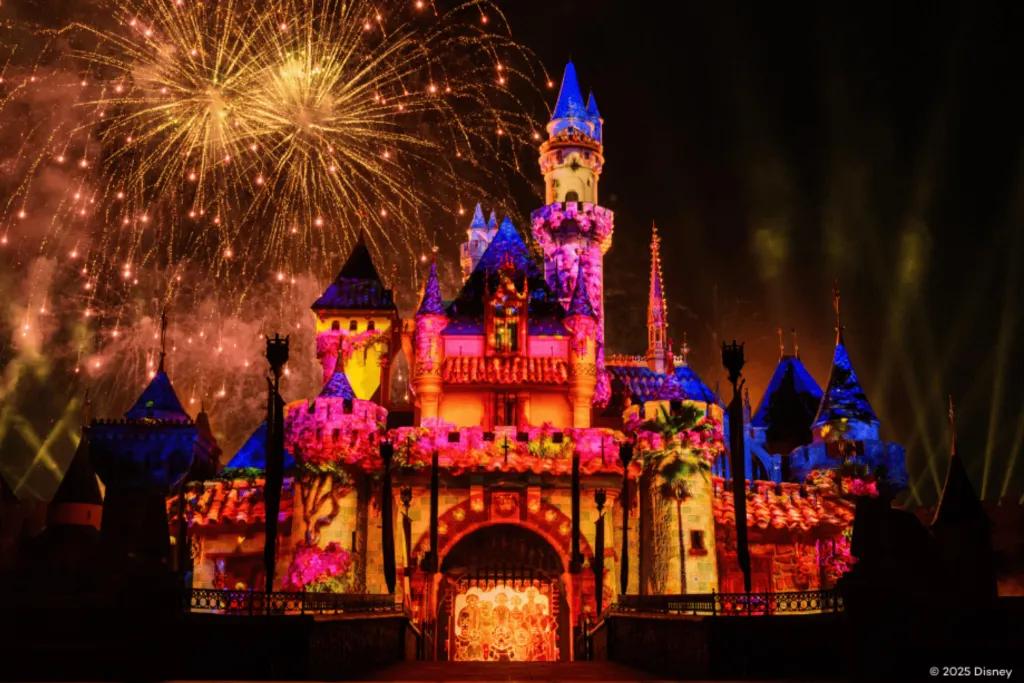 Sleeping Beauty Castle at Disneyland Resort with fireworks in the background and projections on the front