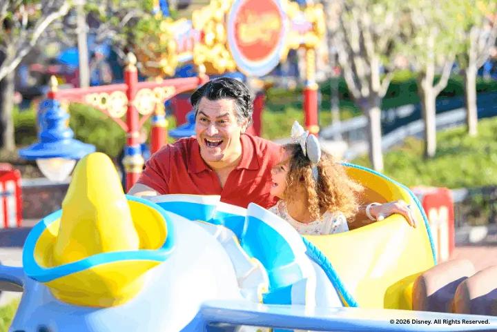 Guests on Dumbo the Flying Elephant at Magic Kingdom Park