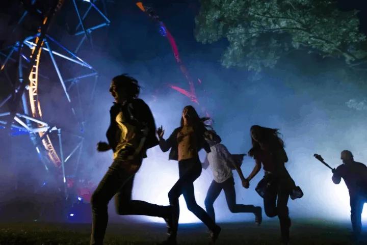A group of friends running in the Howl-O-Scream event at Busch Gardens