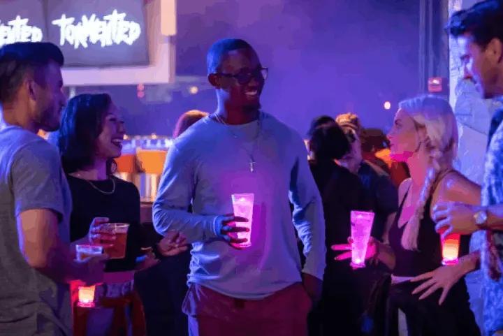 A group of people enjoying drinks at Howl-O-Scream event in SeaWorld Orlando