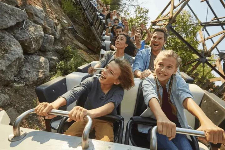 A family riding on a roller coaster at PortAventura World