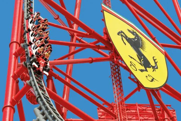 Guests riding Red Force roller coaster in Ferrari Land