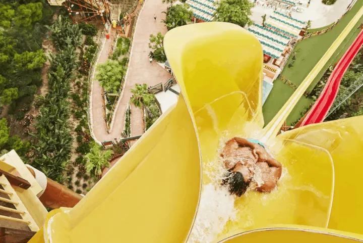 Guest sliding down the King Khajuna ride at Caribe Aquatic Park