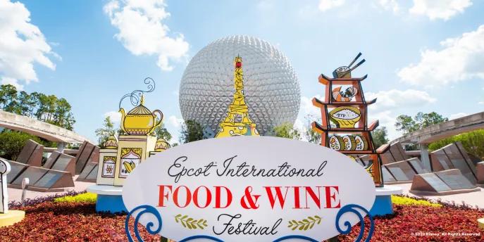 A sign reading "EPCOT International Food and Wine Festival" in front of Spaceship Earth