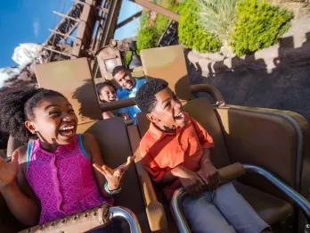 Two guests smiling as they go down the drop on Expedition Everest