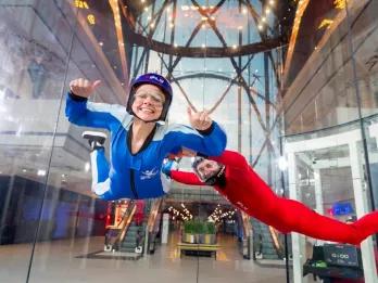 Guest-and-trainer-skydiving-indoors