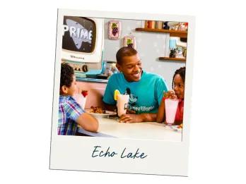 A polaroid labelled Echo Lake with a picture of a family drinking milkshakes at a table inside