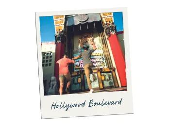 A polaroid labelled Hollywood Boulevard with a picture of two men jumping in front of a replica of the Chinese Theater inside