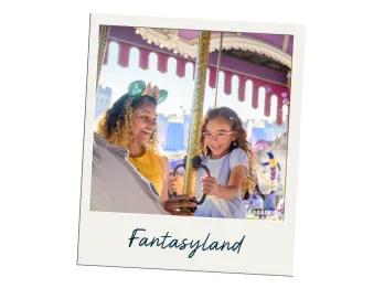 Image of young girl wearing purple dress sat on white carousel horse with a gold pole. The mother is standing next to her smiling brightly looking at the young girl, she is also wearing turquoise and pink mickey ears.