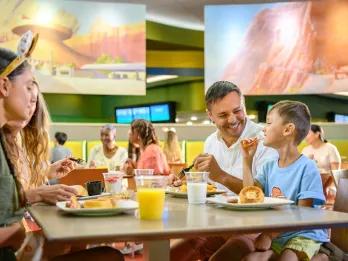 A family eating a fast-casual breakfast in a restaurant