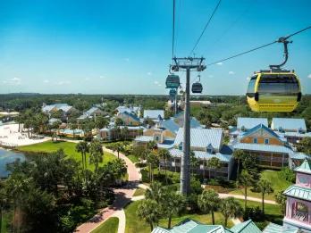 A cable car track going over a Caribbean-inspired hotel