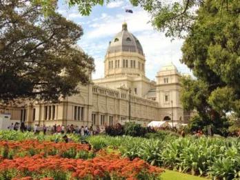 Royal Exhibition Building exterior surrounded by greenery during the Melbourne City Discovery Tour