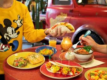 People at a restaurant table eating Mexican food