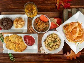 A bird's eye view of a table full of autumnal food dishes