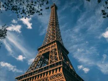 A view looking up at the Eiffel Tower in Paris