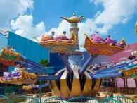 Guests riding the Flying Carpets Over Agrabah ride at Disneyland Paris