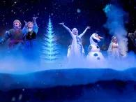 Elsa, Anna, Kristoff and Olaf singing on stage