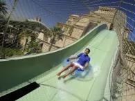 Happy rider on Plunge waterslide at Atlantis Aquaventure Waterpark