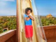 Excited rider on Poseidon's Revenge waterslide at Atlantis Aquaventure Waterpark