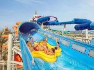 Five happy riders on Shockwave water ride at Atlantis Aquaventure Waterpark