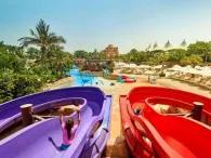 Children riding colourful water slides at Splashers Island, Atlantis Dubai Aquaventure