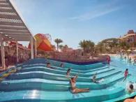 Children riding water slides at Splashers Lagoon, Atlantis Dubai Aquaventure Waterpark
