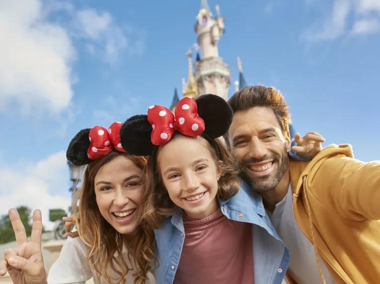 Family in front of Sleeping Beauty Castle at Disneyland Paris