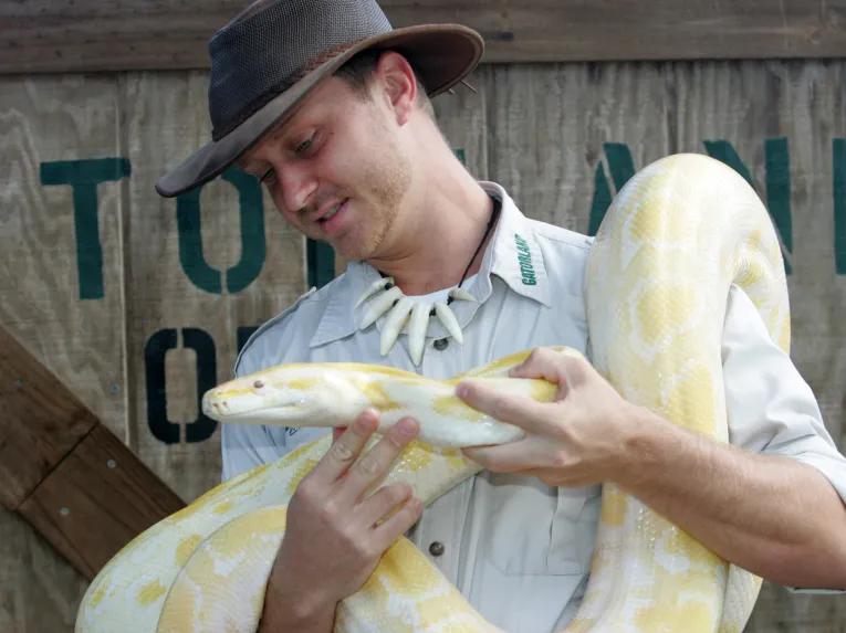 Zoo keeper with Yellow Boa at Gatorland in Florida