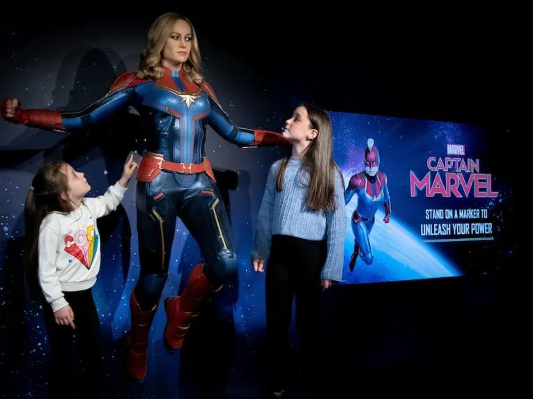 Girls with Captain Marvel at Madame Tussauds London