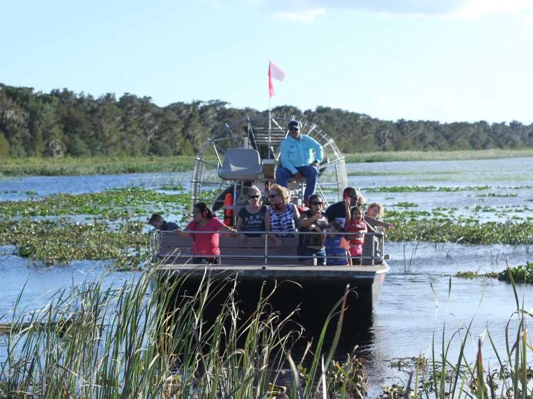 Guests enjoying an airboat ride at Boggy Creek Orlando