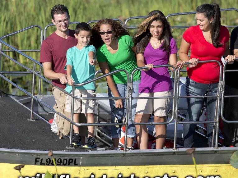 Guests spotting native wildlife on a wild florida airboat ride