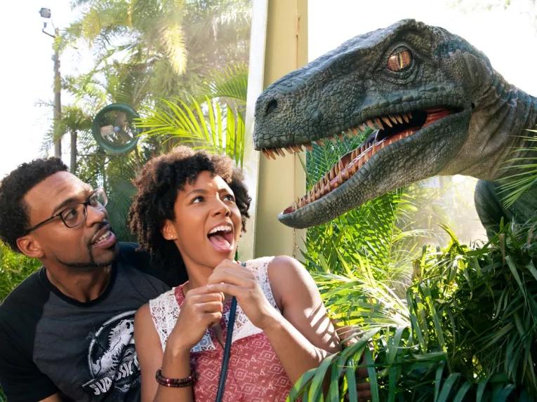 Couple being surpised by a raptor at Universal's Islands of Adventure