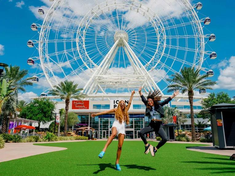 Girls in front of the Icon Orlando Wheel