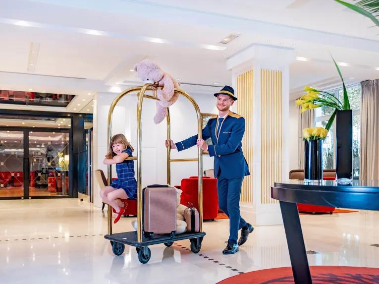 Bellboy and guest at Relais Spa Val d'Europe