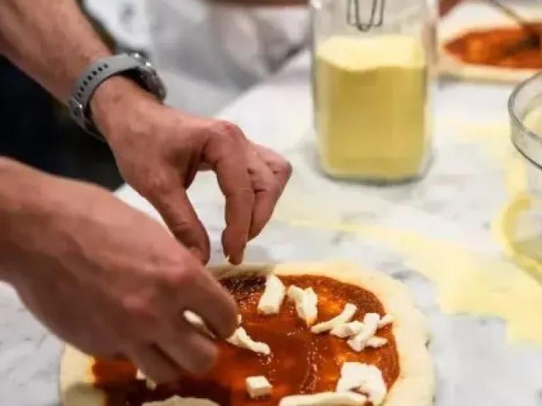 decorating pizza