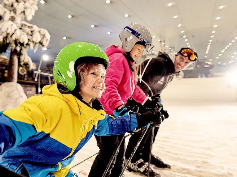 Family enjoying skiing at Ski Dubai