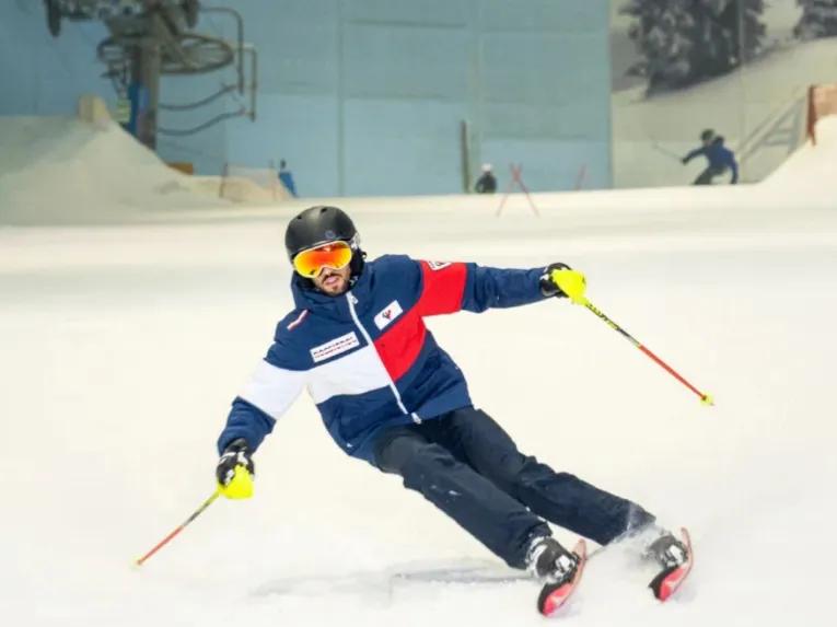 Person skiing on an indoor slope at Ski Dubai