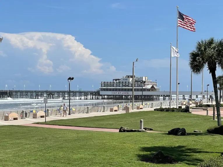 View of the historic Daytona Beach Main Street Pier and boardwalk on a day tour from Orlando