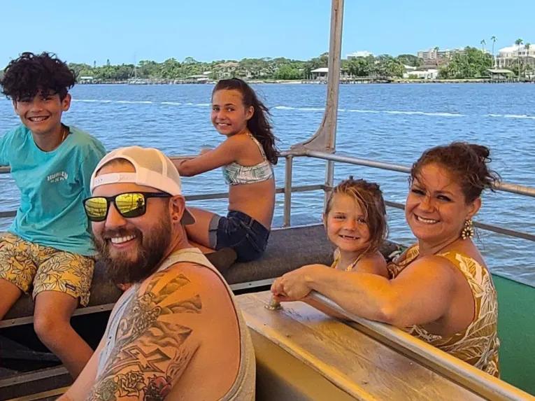 Happy passengers on an boat ride excursion on a Daytona Beach tour from Orlando